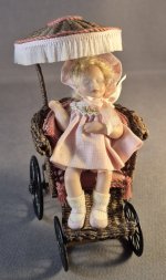 Sleeping toddler in wicker carriage
