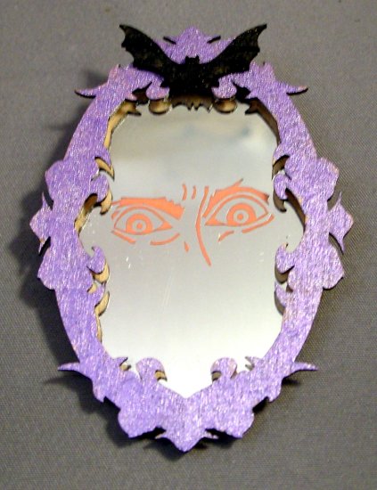 Spooky face in mirror, oval, one inch scale - Click Image to Close